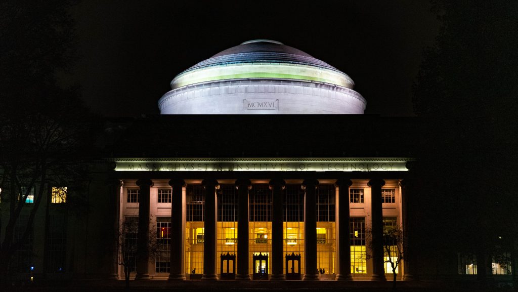 Image of the main MIT Campus building at night